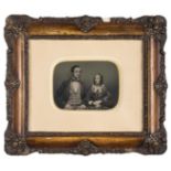 *Half-plate ambrotype of a newly married couple, 1850s, tinted, 11 x 15cm, cream mat, decorative