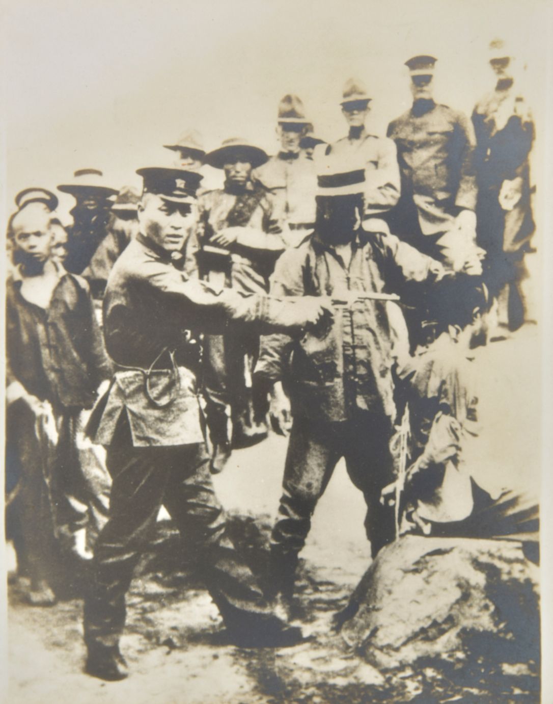 *China. Executions, Canton, early 20th century, a pair of large silver print photographs, one of '