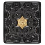 *Geometric/Scroll. Sixth-plate black thermoplastic union case by Peck & Halvorson, c. 1858,