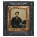 *Three thermoplastic sixth-plate wall frames, 1860s, containing tinted ambrotype portraits of a man,