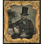 *Sixth-plate ambrotype portrait of a seated gentleman with a top hat, by F. Reynolds Photographic