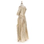 *Dress. A Spitalfields silk overdress, circa 1790, hand-sewn dress of cream silk, with all-over self