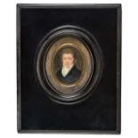 *Miniature. Oval portrait miniature of a young gentleman, circa 1820, oval gouache portrait, showing