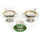 *Dresden. Set of six porcelain bowls, each richly gilded on a blue ground supported in twin handle