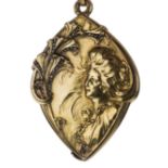 *Pendant. Art Nouveau yellow metal pendant, embossed with a female and stylised flowers enhanced