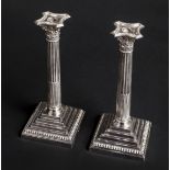 *Candlesticks. A pair of silver Corinthian column candlesticks, by James Dixon & Sons, Sheffield