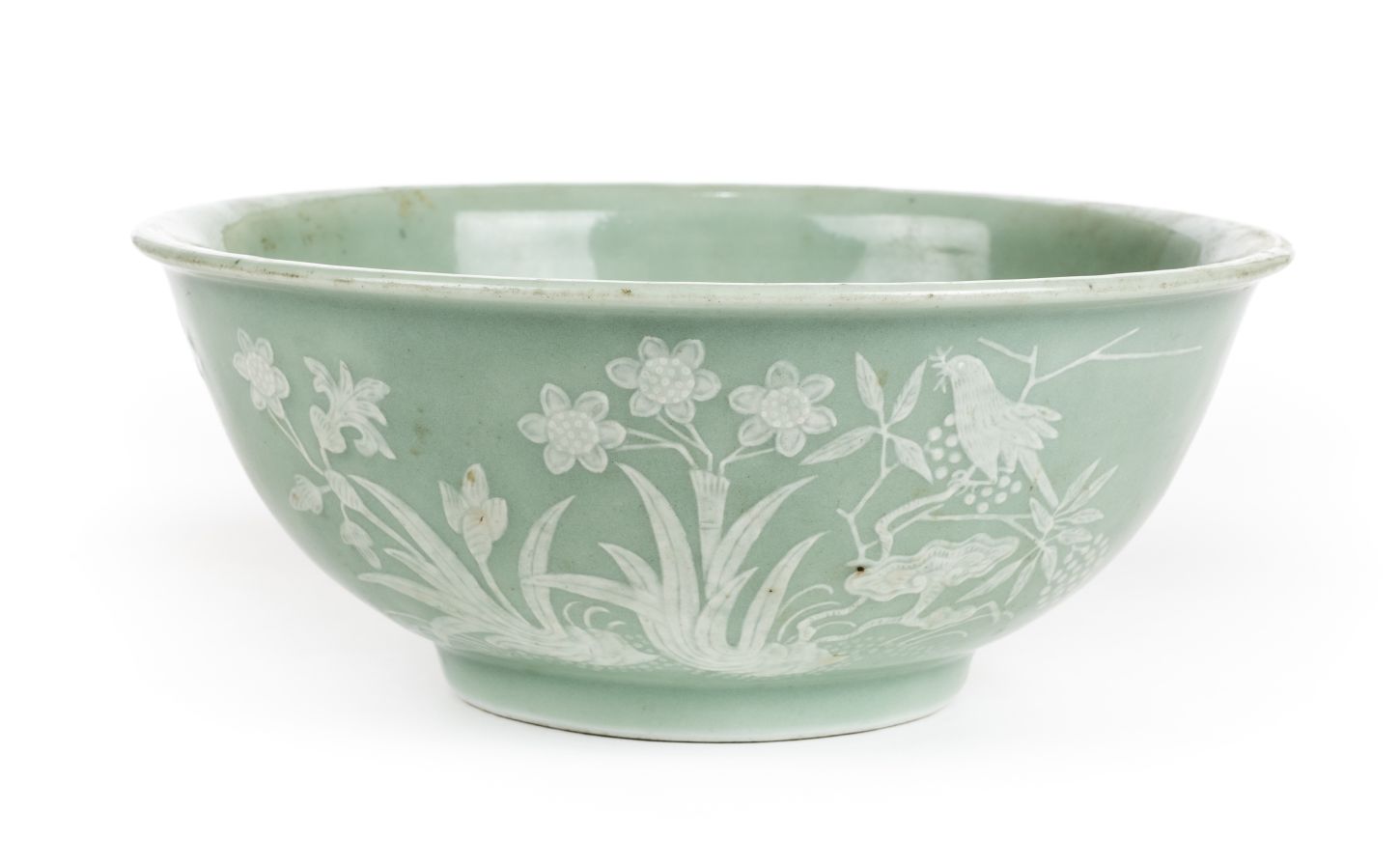 *Bowl. A Chinese celadon porcelain bowl, with pate-sur-pate decoration depicting butterflies,