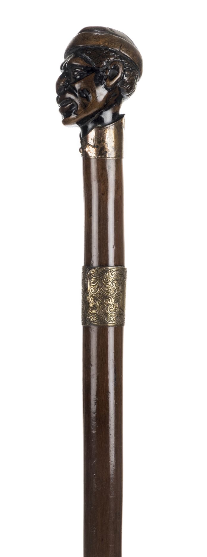 *Walking Stick. 19th century walking stick, the knop carved as a Negro wearing a tasselled hat