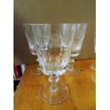 *Tumblers. A set of 8 cut glass stemmed wine glasses, each engraved with the Hardy crest, 16cm