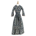 *Dress. A damask gown, circa 1840s, hand-sewn dress of damask with woven silver rose sprays on a