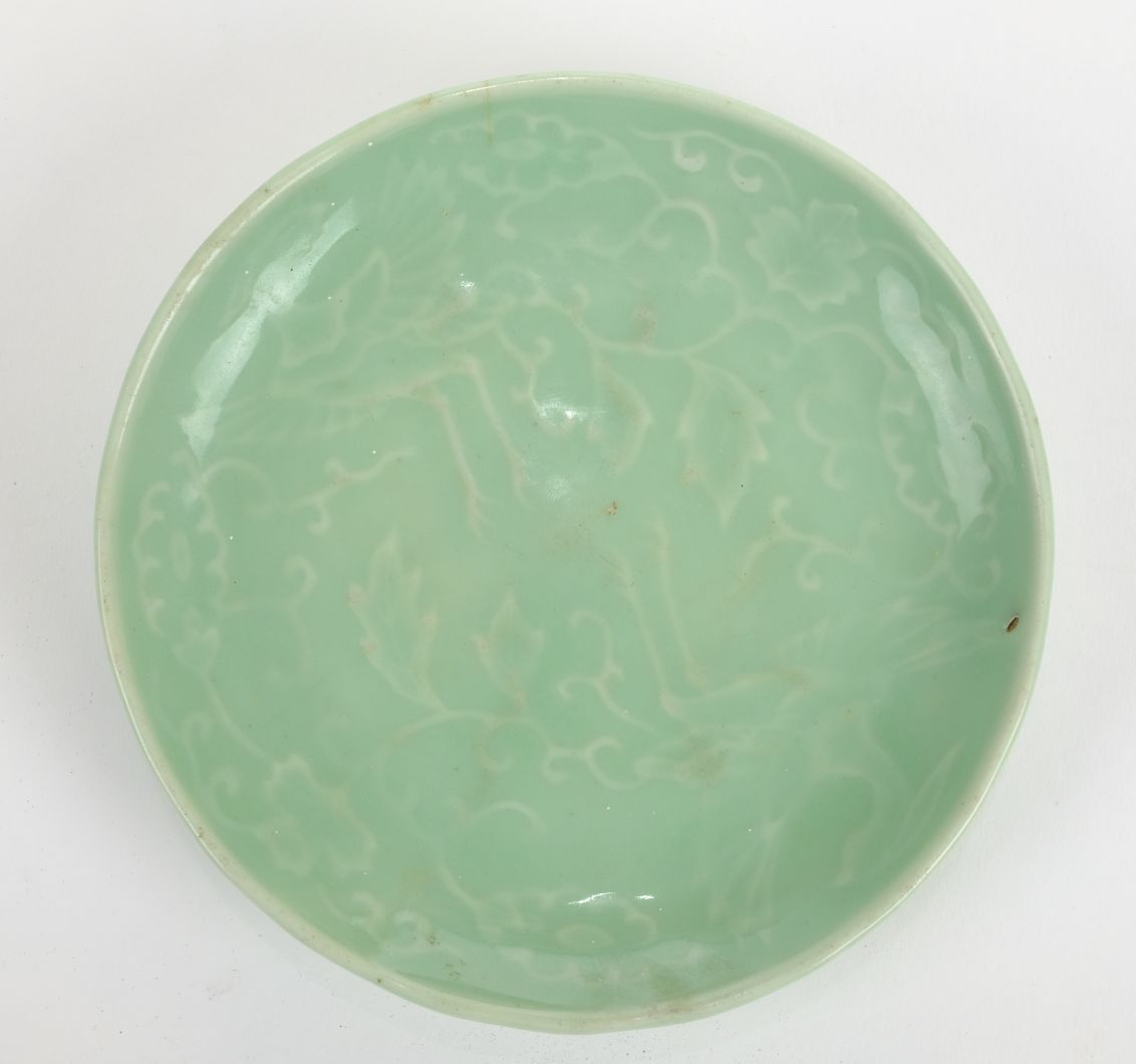 *Dish. A Chinese celadon porcelain dish, with raised decoration of a bird within foliage, blue 5 - Image 3 of 4