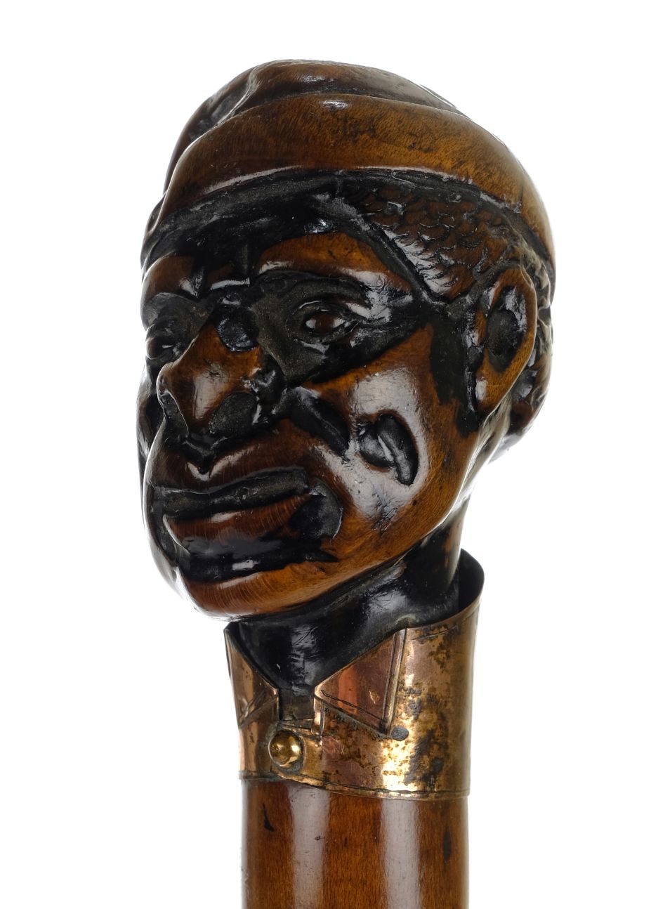 *Walking Stick. 19th century walking stick, the knop carved as a Negro wearing a tasselled hat - Image 2 of 3