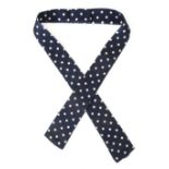 *Churchill (Winston S., 1874-1965). A navy and white spotted bow tie formerly owned and worn by