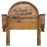 *Headboard. An early 20th century Continental carved pine headboard, carved with egg and dart