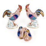 *Figurines. A pair of Herend porcelain cockerels, each finely painted with blue back stamp, 14cm