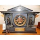 *Mantel Clock. A 19th century Belgian slate clock, of architectural form, the copper dial with black