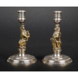 *Candlesticks. Pair of silver and gilt candlesticks by Garrard & Co, London 1978, one modelled as