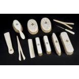 *Dressing Table Set. Victorian ivory dressing table set, comprising four brushes and shoehorn,