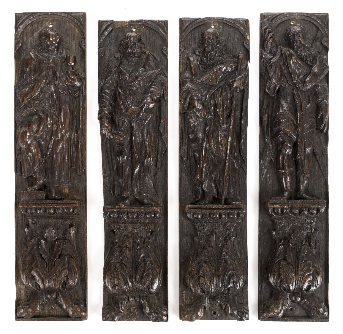 *Carved Oak Panels. Set of four antique carved oak panels, probably 17th century, carved as saints