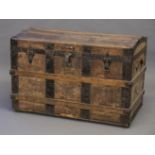 *Trunk. A late 19th century travelling trunk, the dome top with slatted struts and leather