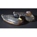 *Duck decoys. Two painted decoys, early 20th century, two carved wooden decoys with crude