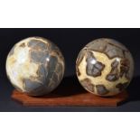 *Septarian calcite spheres on stand, Utah, USA, each approximately 15cm across, stand length 29cm (