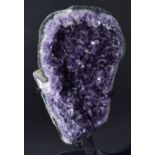 *A beautiful amethyst specimen, Uruguay, formed with deep colour, on a stand, 33cm high, overall