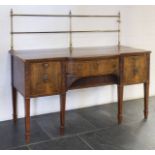 *Sideboard. Edwardian mahogany sideboard, the shaped top with brass back, above central drawer