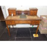 *Desk. Edwardian rosewood writing desk, with brass gallery top above four raised drawers and