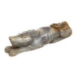 *Jade Carving. A Chinese carving of a recumbent dog, carved in the archaic style, 14cm long (1)