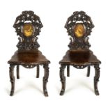 *Hall Chairs. Pair of late 19th century carved wood hall chairs, probably Swiss or German, each