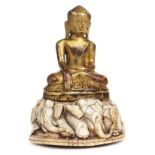 *Buddha. Ivory seated Buddha with elephants from Burma, Shan States, 17-18th century, carved from