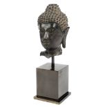*Buddha. A 16th century Thai bronze head of Buddha from Thailand, the face contemplative and