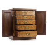 *Chest. Victorian burr walnut collector's chest, the inlaid doors enclosing five drawers each with