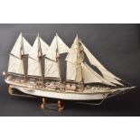 *Model Ship. Wooden scale model ship of 'Juan Sebastian Elcano', with four fully rigged sails,