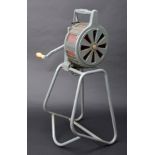 *Air Raid Siren. WWII air raid siren, grey painted frame with wooden handle, in working condition,