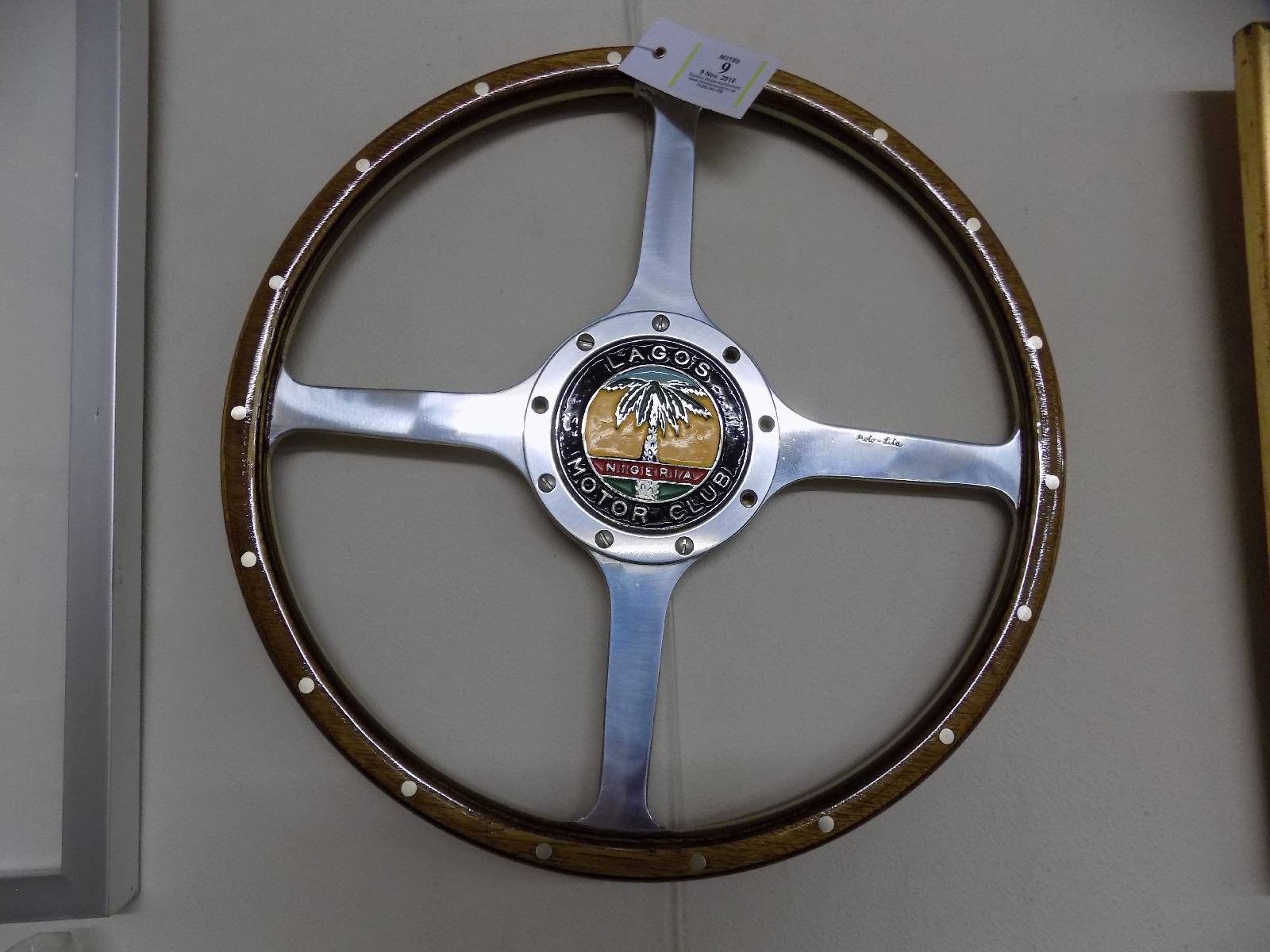 *Moto-Lita Steering Wheel. A 15-inch wooden rimmed steering wheel, with a Lagos Motor Club painted