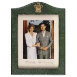 *Charles (Prince of Wales, & Diana, Princess of Wales). Three-quarter length portrait of the arm-