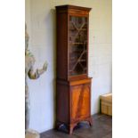 *Bookcase. George III style mahogany bookcase, of slender proportions, the key frieze above single