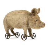 *Steiff. Pig on wheels, Germany, circa 1905/6, stuffed blonde mohair pig, with black boot button