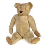 *Teddy. A large teddy bear, Chad Valley, circa 1930, a jointed light golden mohair teddy bear with