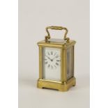 A FRENCH MINIATURE BRASS CASED CARRIAGE CLOCK