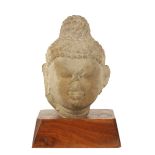 CARVED SANDSTONE HEAD OF A BUDDHA, INDIA, 3RD CENTURY OR LATER