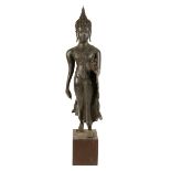 BRONZE FIGURE OF A WALKING BUDDHA, THAILAND, 18TH / 19TH CENTURY