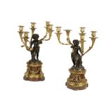 PAIR OF PATINATED BRONZE AND ORMOLU FIVE-BRANCH CANDELABRA