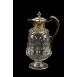 A LATE VICTORIAN SILVER MOUNTED CLARET JUG