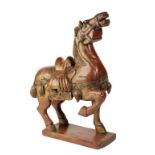 CARVED RED LACQUER TANG STYLE HORSE, 20TH CENTURY