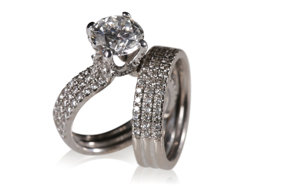 DIAMOND SOLITAIRE RING TOGETHER WITH A DIAMOND SET WEDDING BAND