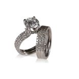DIAMOND SOLITAIRE RING TOGETHER WITH A DIAMOND SET WEDDING BAND