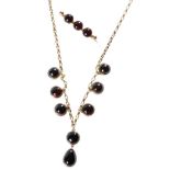 GARNET AND UNMARKED YELLOW GOLD NECKLACE